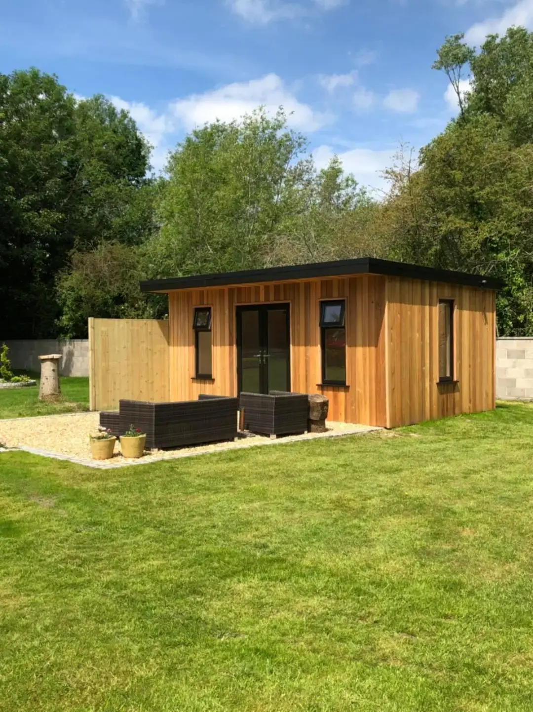 Modern timber garden room with outdoor seating