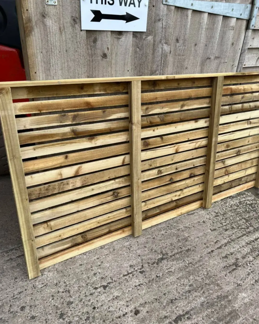 Horizontal slatted timber fence panel